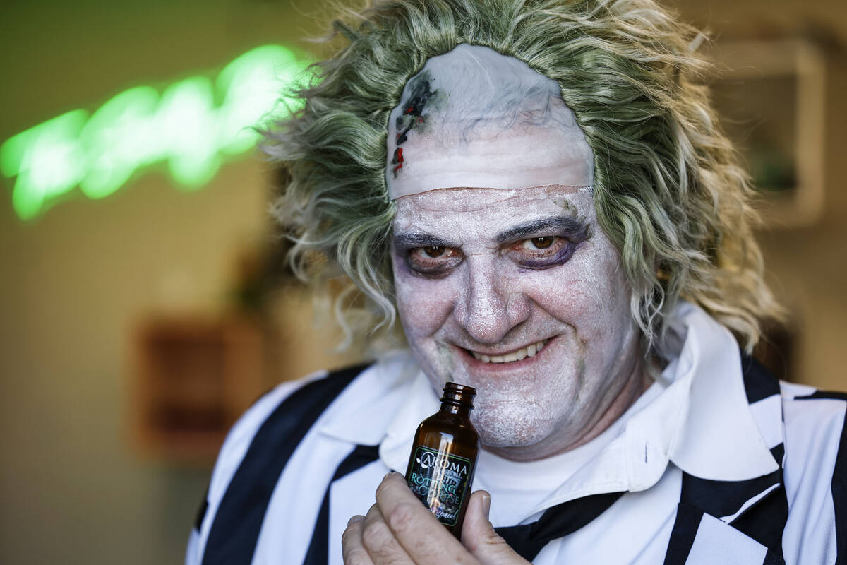 Aroma Retail’s CEO Jim Reding holds a bottle of their Halloween-inspired scent “R ...