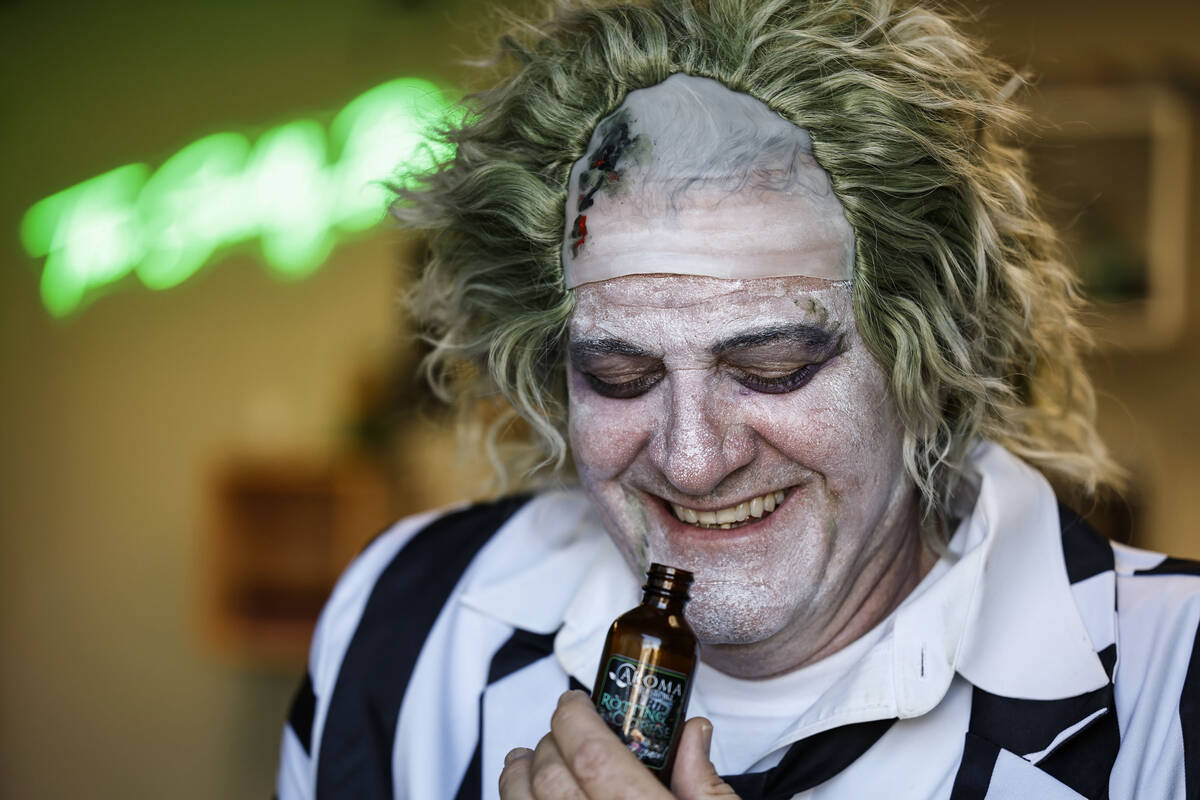 Aroma Retail’s CEO Jim Reding holds a bottle of their Halloween-inspired scent “R ...