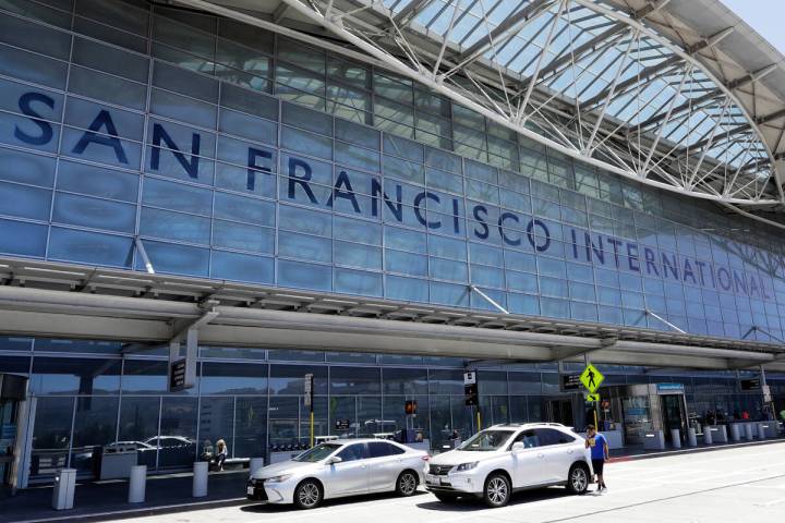 FILE - Vehicles wait outside the international terminal at San Francisco International Airport ...
