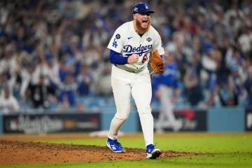 Los Angeles Dodgers pitcher Will Klein celebrates against the Toronto Blue Jays during the 16th ...