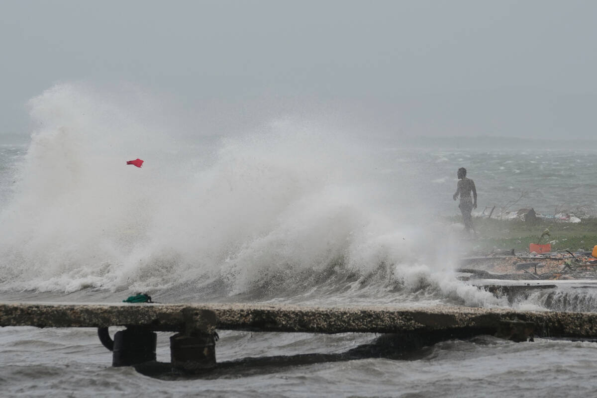 Waves splash in Kingston, Jamaica, as Hurricane Melissa approaches, Tuesday, Oct. 28, 2025. (AP ...