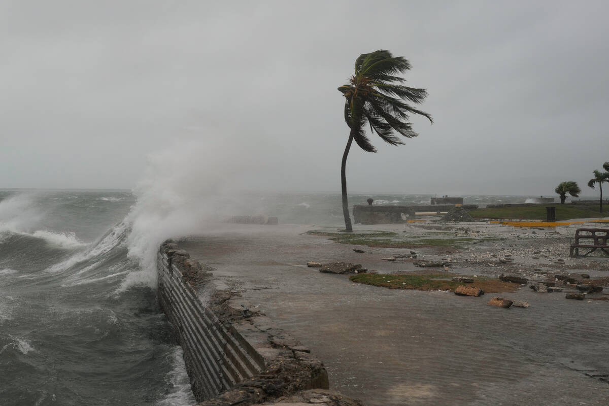 Waves splash in Kingston, Jamaica, as Hurricane Melissa approaches, Tuesday, Oct. 28, 2025. (AP ...