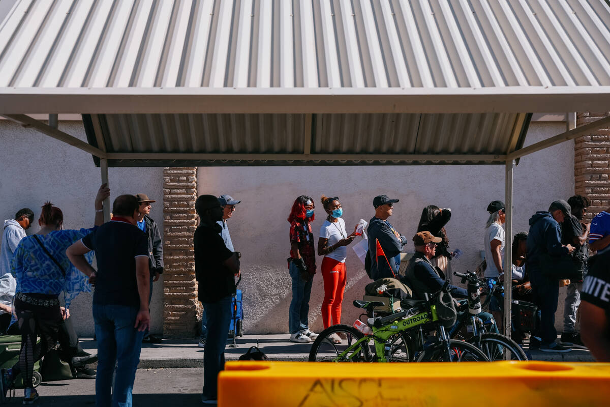 People line up to get food from City Impact Urban Food Bank on Tuesday, Oct. 28, 2025 in Las Ve ...