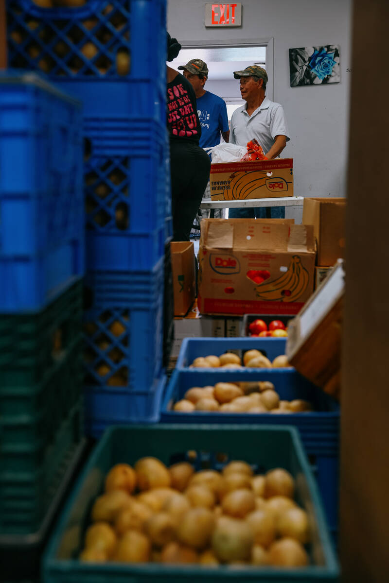 Volunteers distribute food boxes at City Impact Urban Food Bank on Tuesday, Oct. 28, 2025 in La ...
