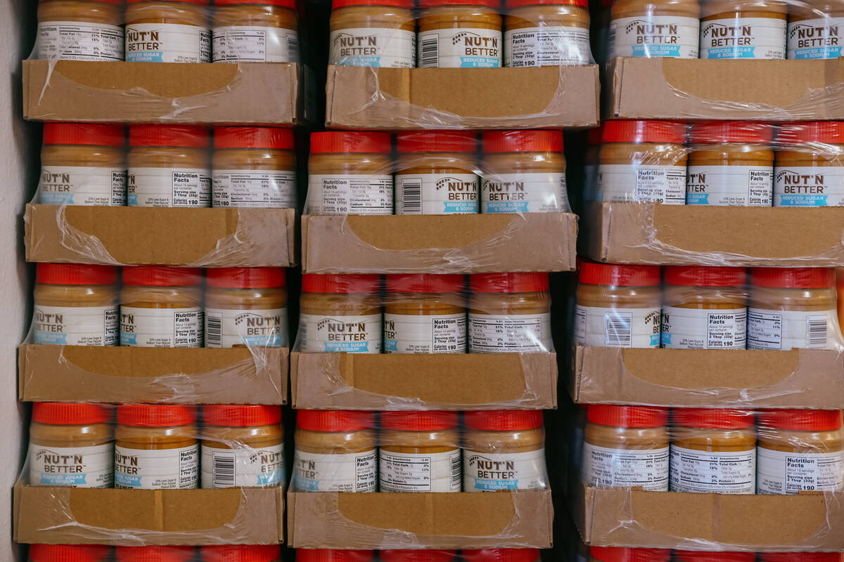 Boxes of peanut butter sit on a pallet at City Impact Urban Food Bank on Tuesday, Oct. 28, 2025 ...