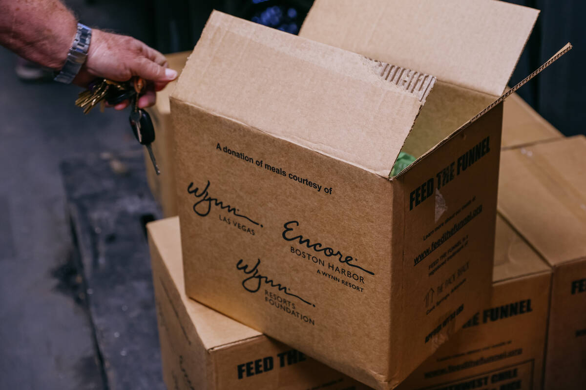 Vic Caruso, executive director of City Impact Center, points out the Wynn branding on the side ...