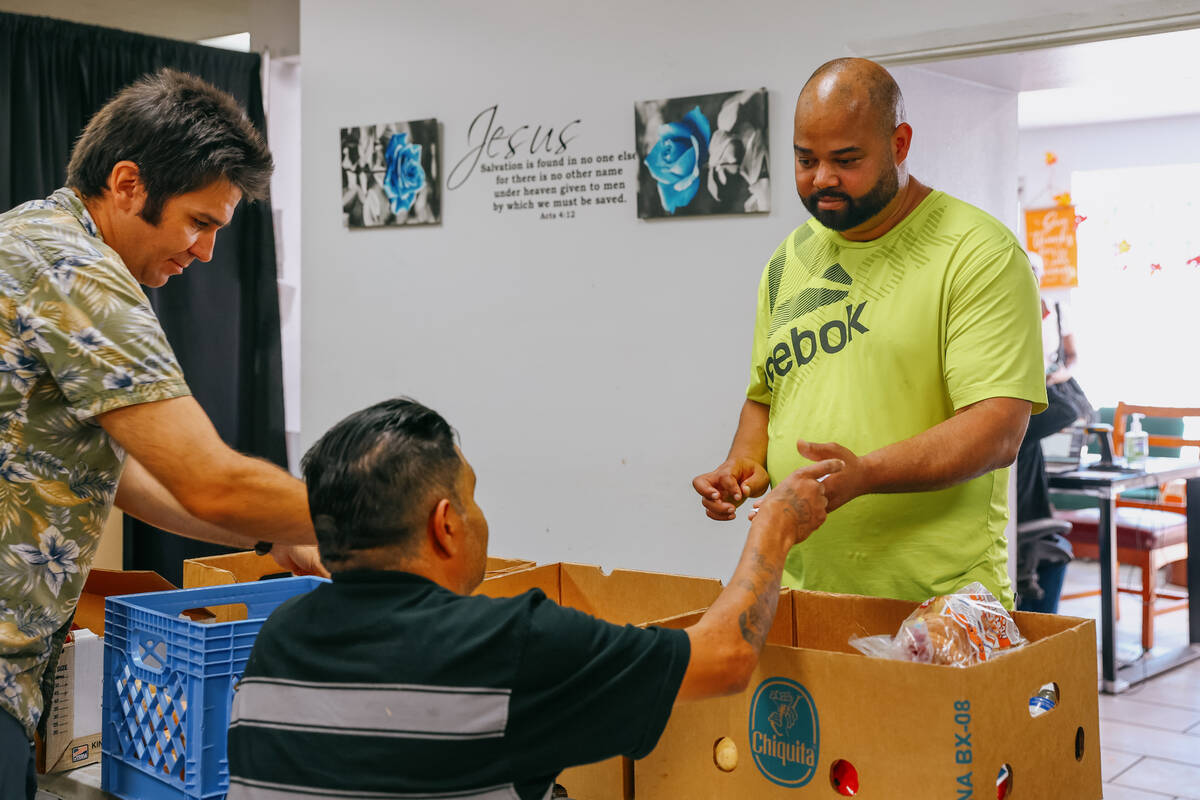 Randy Alberto Gonzalez receives a box of food at City Impact Urban Food Bank on Tuesday, Oct. 2 ...
