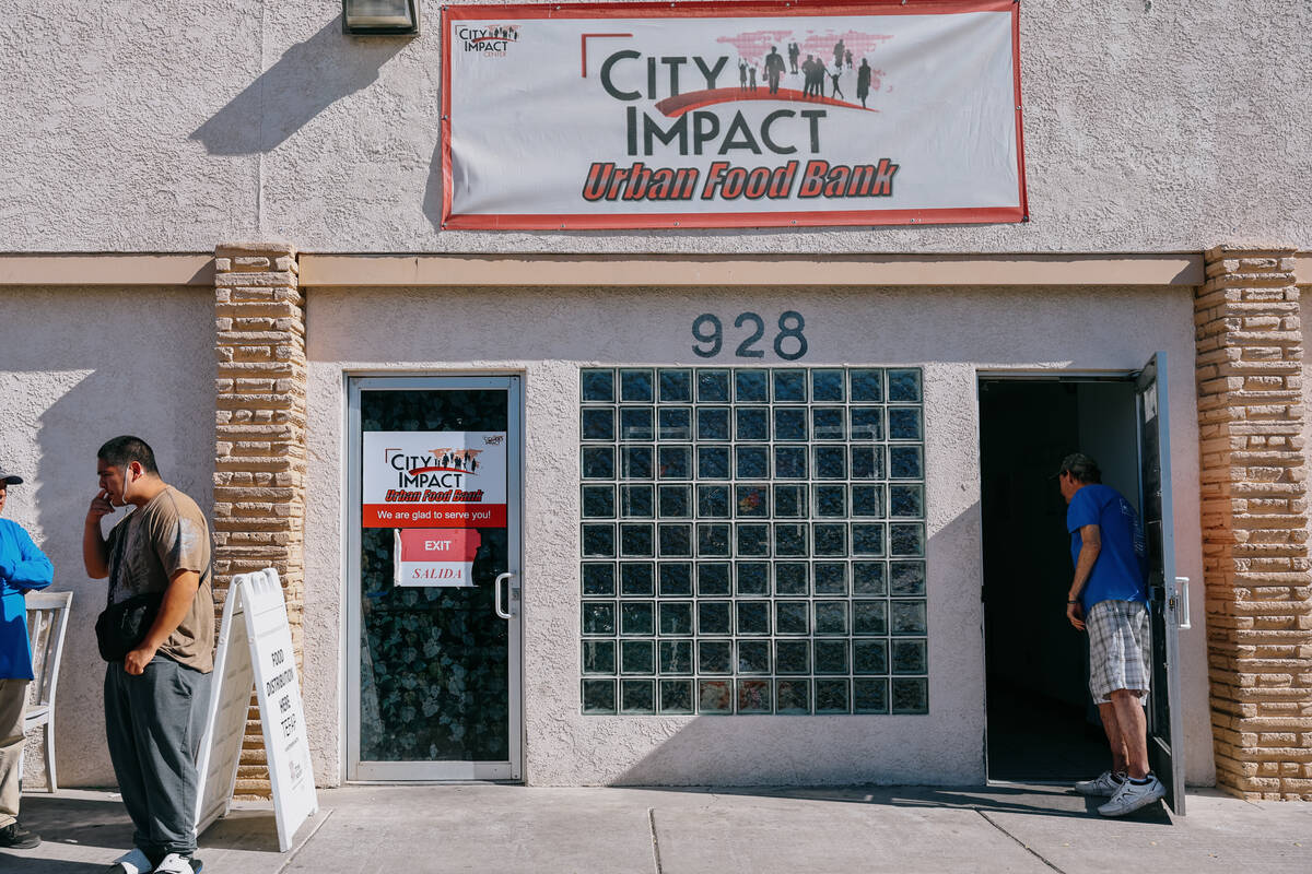 People line up to get food from City Impact Urban Food Bank on Tuesday, Oct. 28, 2025 in Las Ve ...