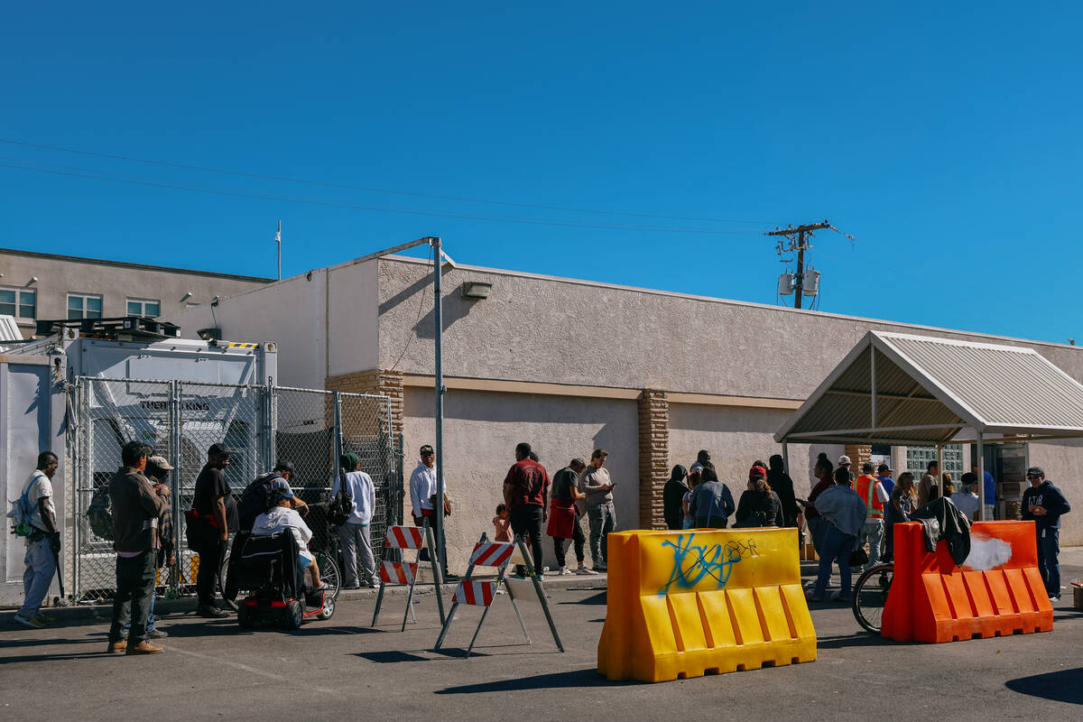 People line up to get food from City Impact Urban Food Bank on Tuesday, Oct. 28, 2025 in Las Ve ...