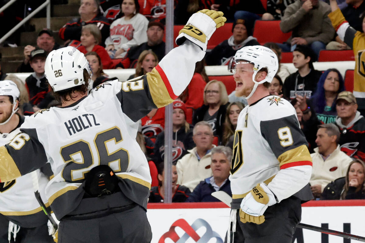 Vegas Golden Knights center Jack Eichel (9) celebrates his goal with right wing Alexander Holtz ...