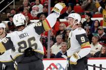 Vegas Golden Knights center Jack Eichel (9) celebrates his goal with right wing Alexander Holtz ...