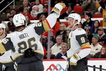 Vegas Golden Knights center Jack Eichel (9) celebrates his goal with right wing Alexander Holtz ...