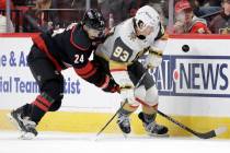Carolina Hurricanes center Seth Jarvis (24) and Vegas Golden Knights right wing Mitch Marner (9 ...
