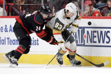 Carolina Hurricanes center Seth Jarvis (24) and Vegas Golden Knights right wing Mitch Marner (9 ...