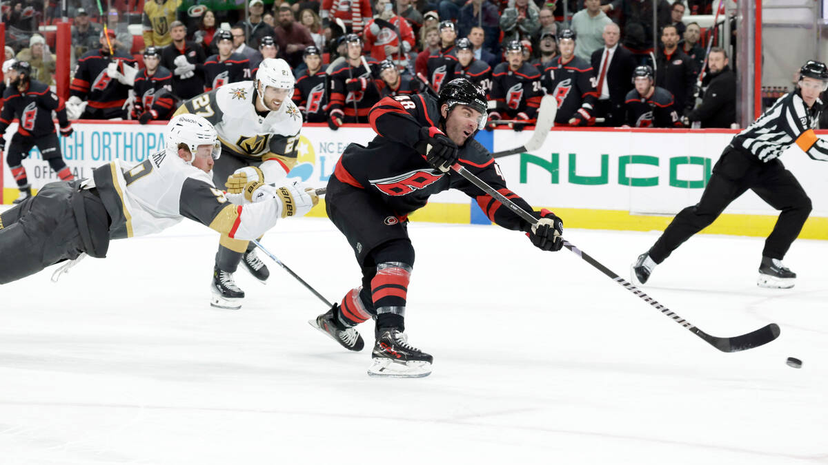 Carolina Hurricanes left wing Jordan Martinook (48) gets past Vegas Golden Knights center Jack ...