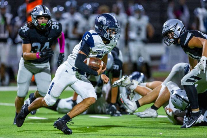 Shadow Ridge quarterback Isaiah Ruiz (5) takes off on a long run as Palo Verde's Trinidad ...