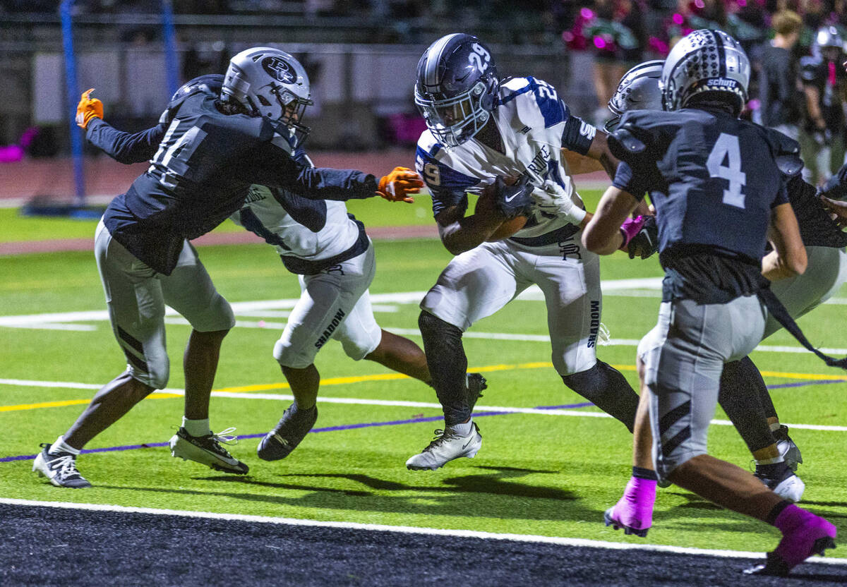 Shadow Ridge runner Trevin Young (29) drives to then end zone with Palo Verde's Christian ...