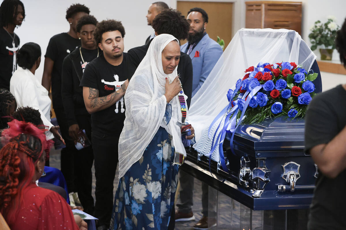 Mourners do a parting view during a memorial service for 12-year-old Jovonn “JoJo” Magee-Th ...