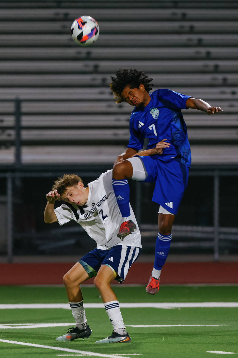 Shadow Ridge striker Gavin Meng (12) and Green Valley defender Dorean Burns (7) compete for a h ...