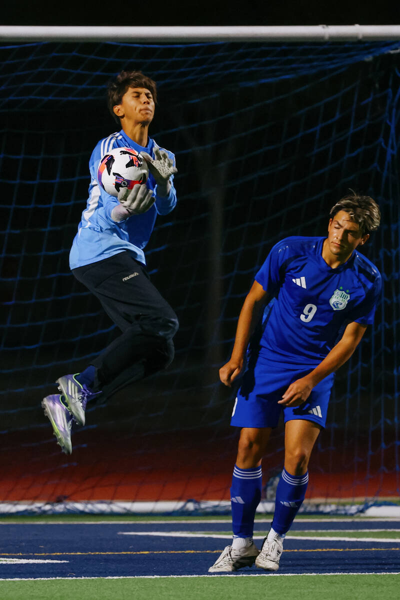 Shadow Ridge goalkeeper Nicklas Yzerman Evans (0) makes a save over Green Valley forward Amilca ...