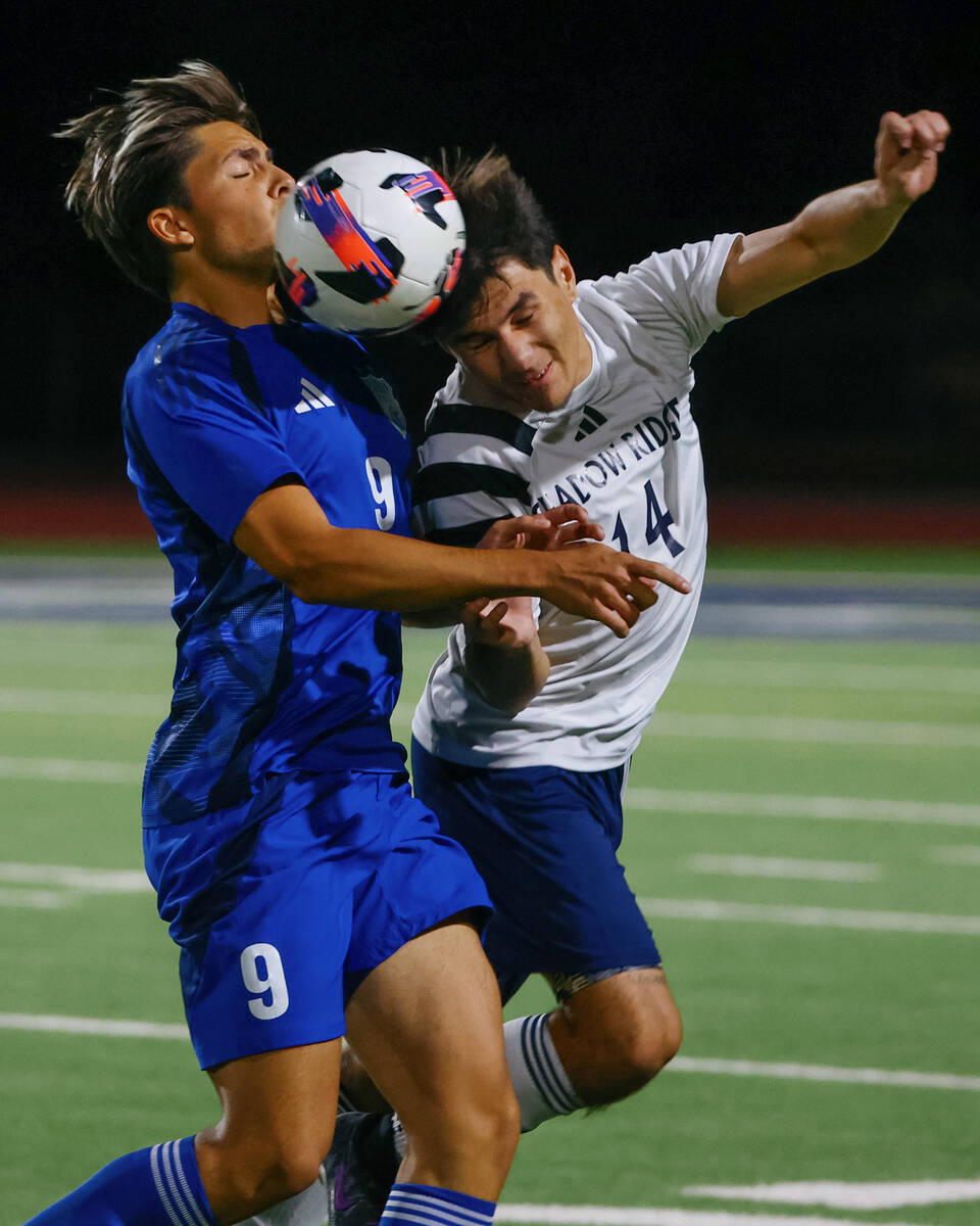 Shadow Ridge midfielder James Zuniga (14) heads the ball in front of Green Valley forward Amilc ...