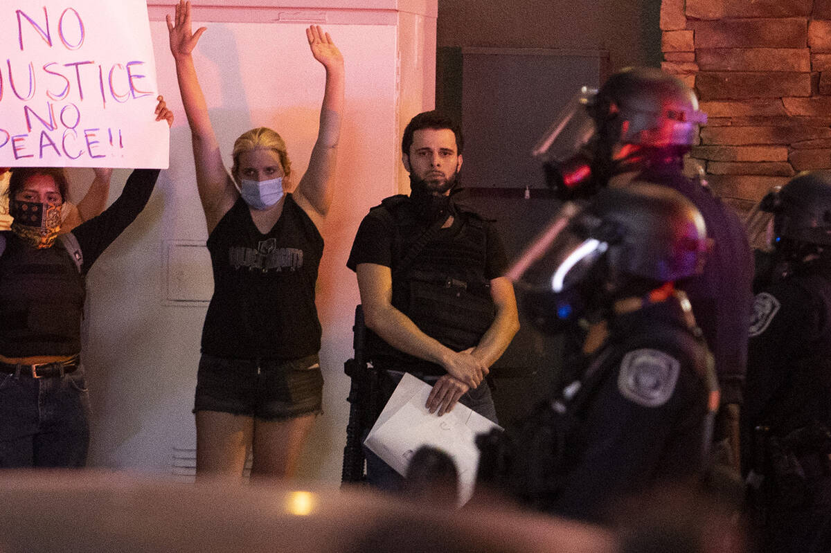 Jorge Gomez, 25, participates in a protest for George Floyd at the intersection of Las Vegas Bo ...