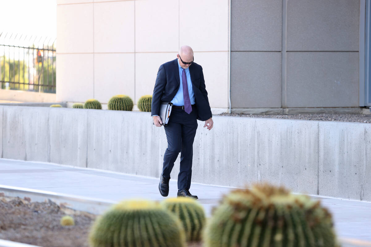 Metropolitan Police Department officer Andrew Locher arrives at Lloyd George U.S. Courthouse in ...
