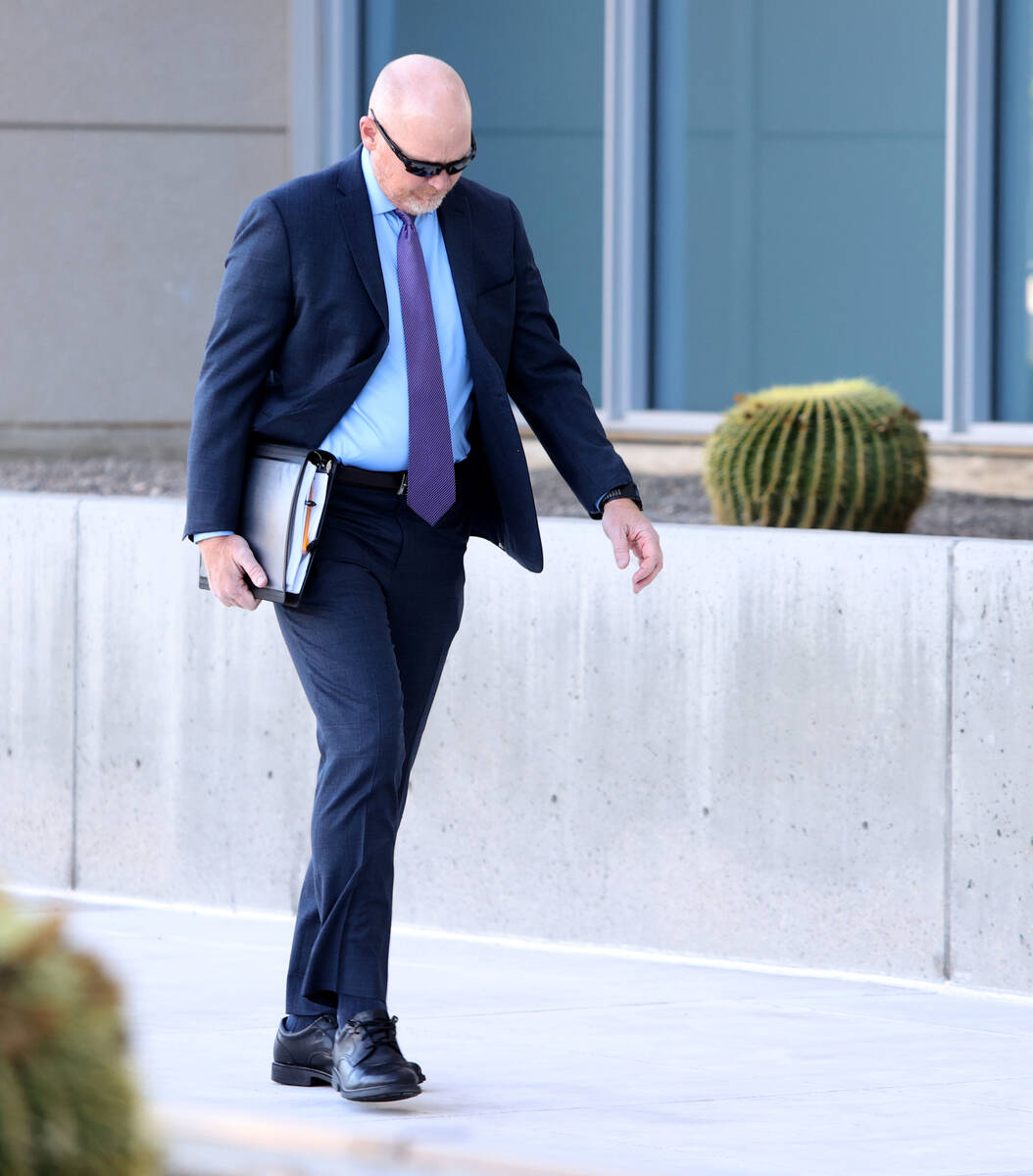 Metropolitan Police Department officer Andrew Locher arrives at Lloyd George U.S. Courthouse in ...