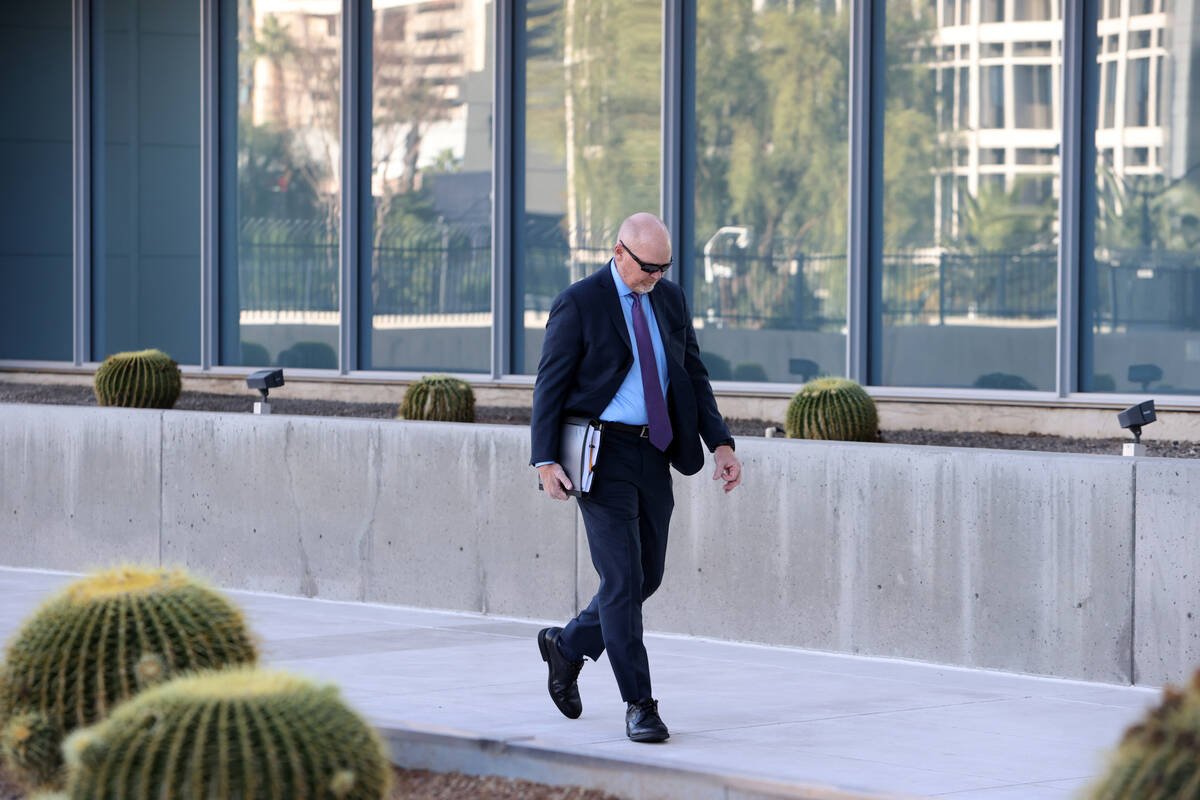 Metropolitan Police Department officer Andrew Locher arrives at Lloyd George U.S. Courthouse in ...