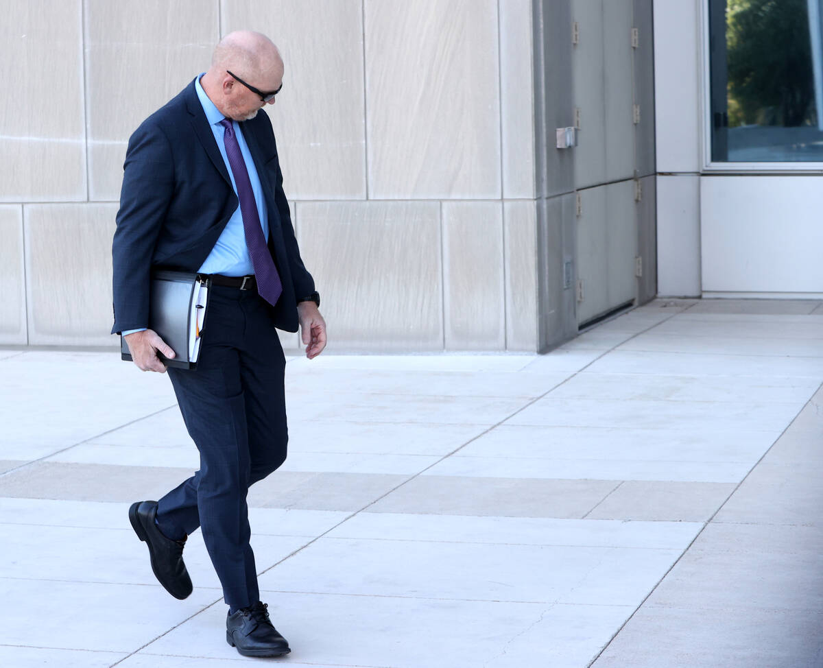 Metropolitan Police Department officer Andrew Locher arrives at Lloyd George U.S. Courthouse in ...