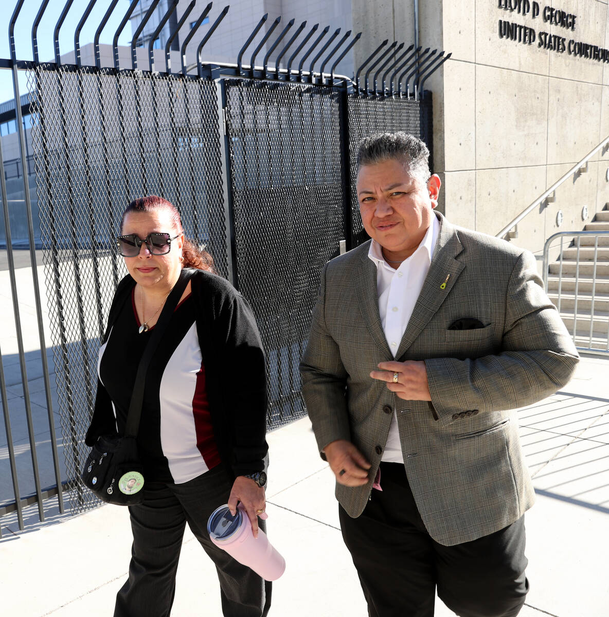 Jeanne Llera, the mother of Jorge Gomez, left, and an unidentified person leave Lloyd George U. ...