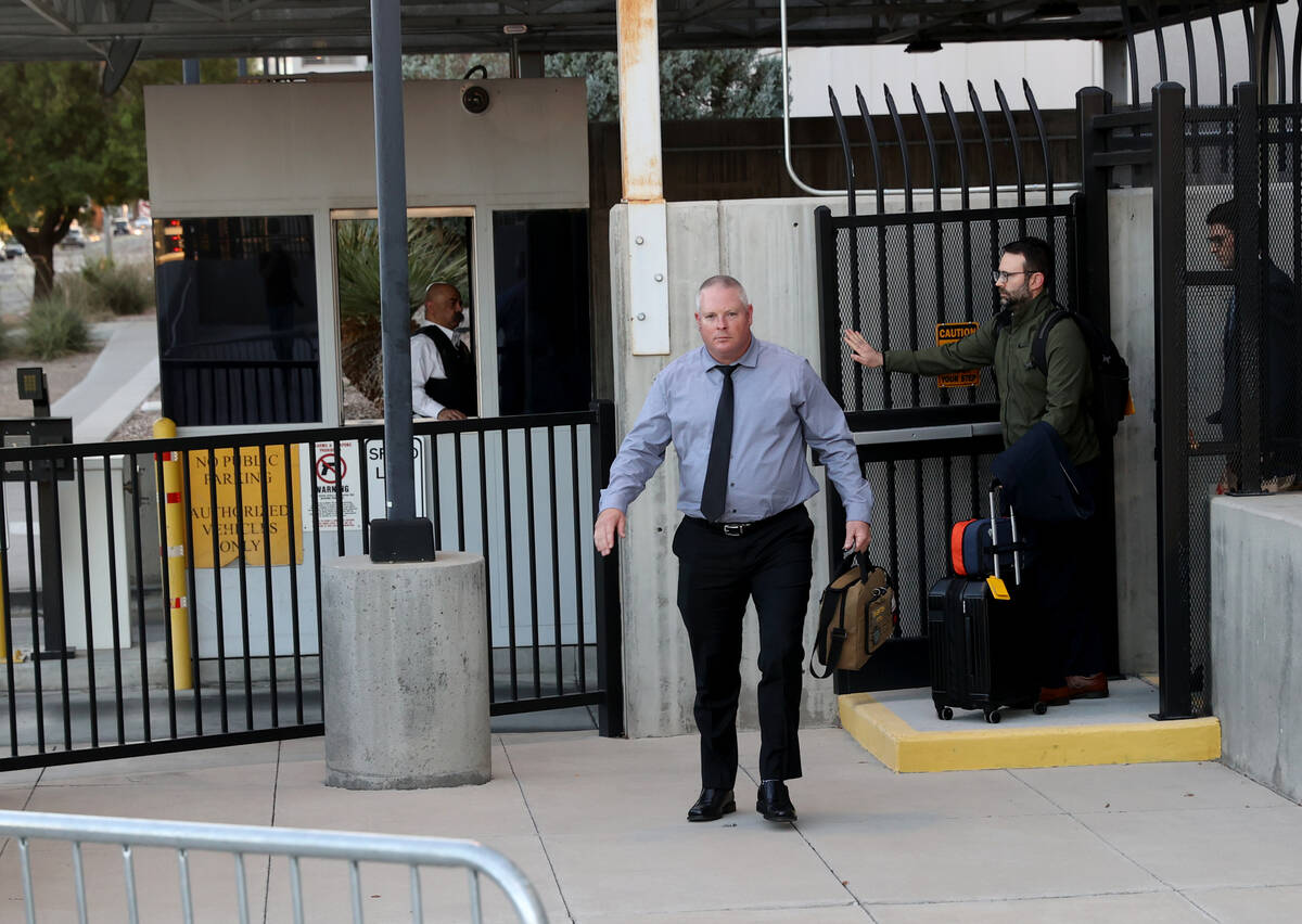 Metropolitan Police Department officer Dan Emerton walks out a back exit at Lloyd George U.S. C ...