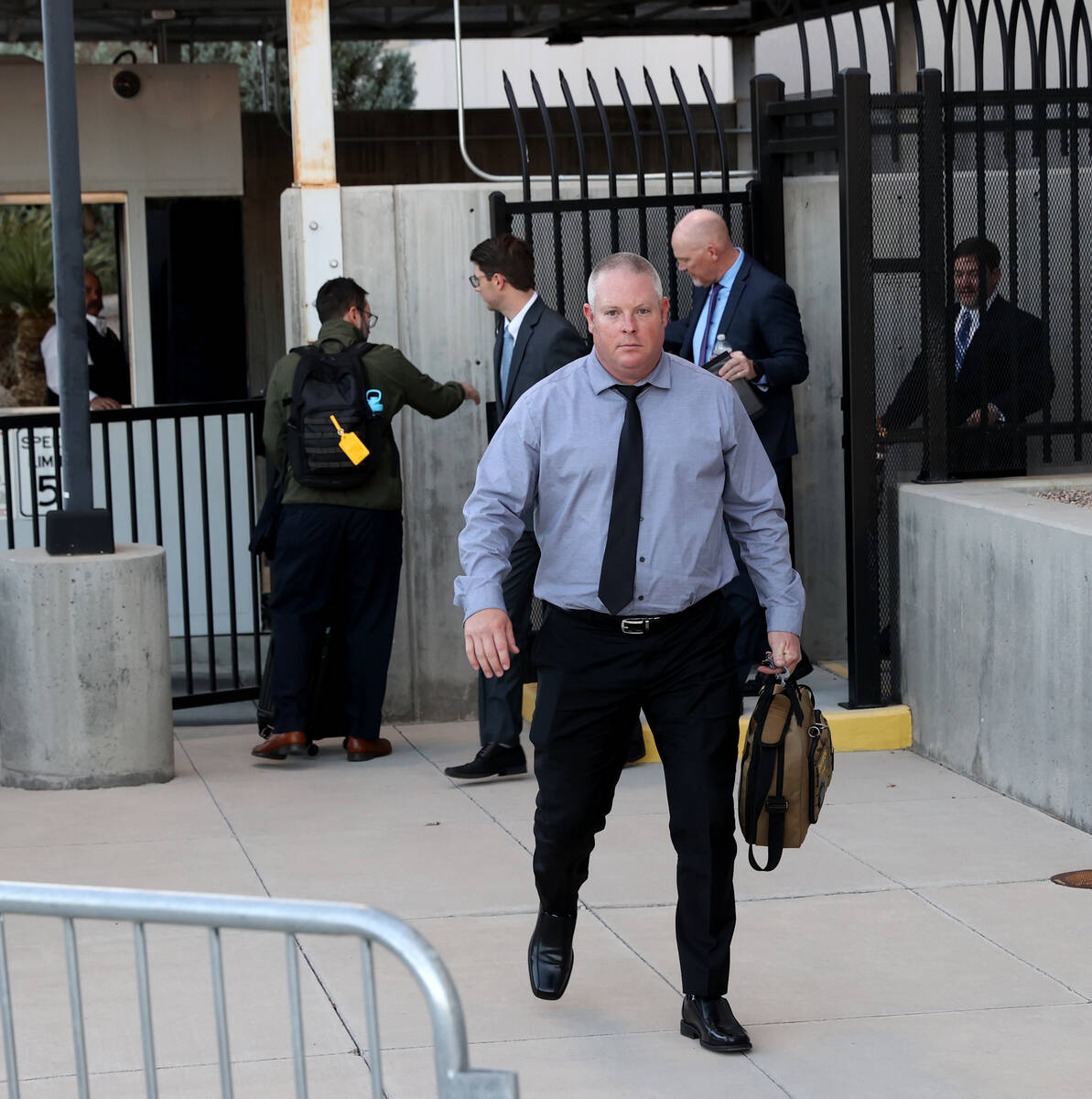 Metropolitan Police Department officer Dan Emerton walks out a back exit at Lloyd George U.S. C ...