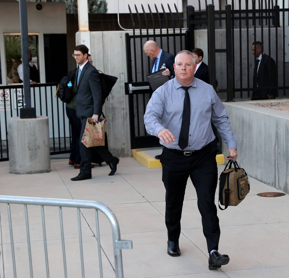 Metropolitan Police Department officer Dan Emerton walks out a back exit at Lloyd George U.S. C ...