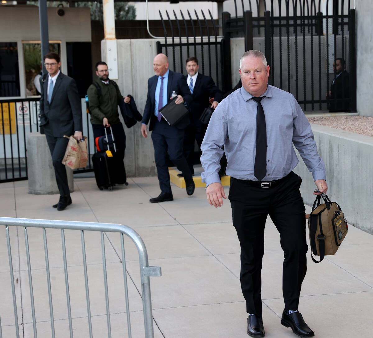 Metropolitan Police Department officer Dan Emerton walks out a back exit at Lloyd George U.S. C ...