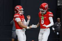 UNLV quarterback Anthony Colandrea (10) celebrates his touchdown with UNLV wide receiver Jaden ...