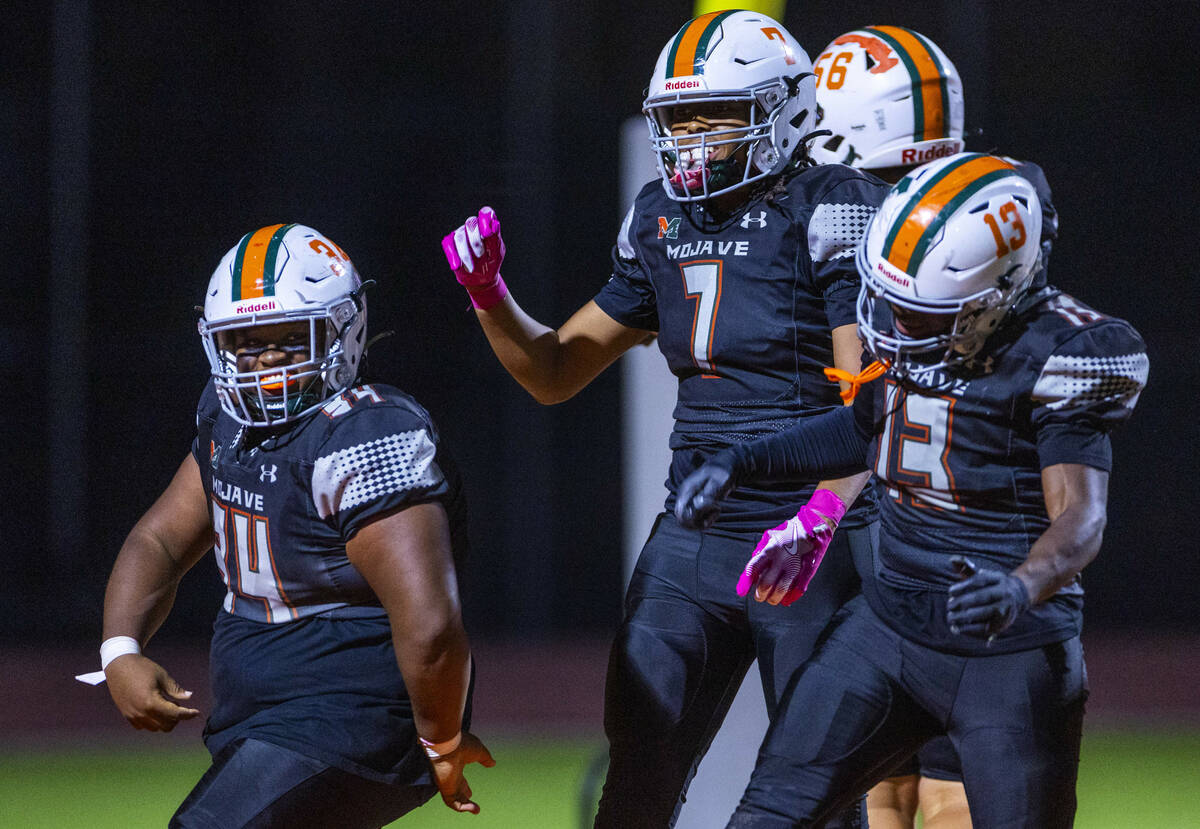 Mojave's Jamaari Williams (34) celebrates a touchdown run with teammates against Palo Verd ...