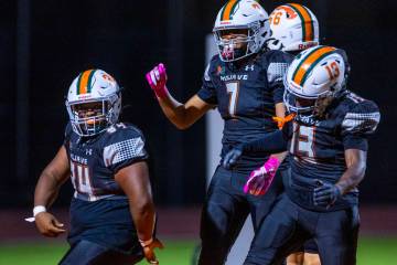 Mojave's Jamaari Williams (34) celebrates a touchdown run with teammates against Palo Verd ...