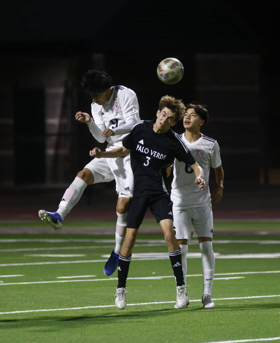 Las Vegas' Jonathan Avina (9) heads the ball against Palo Verde's Henry Reed (3) duri ...
