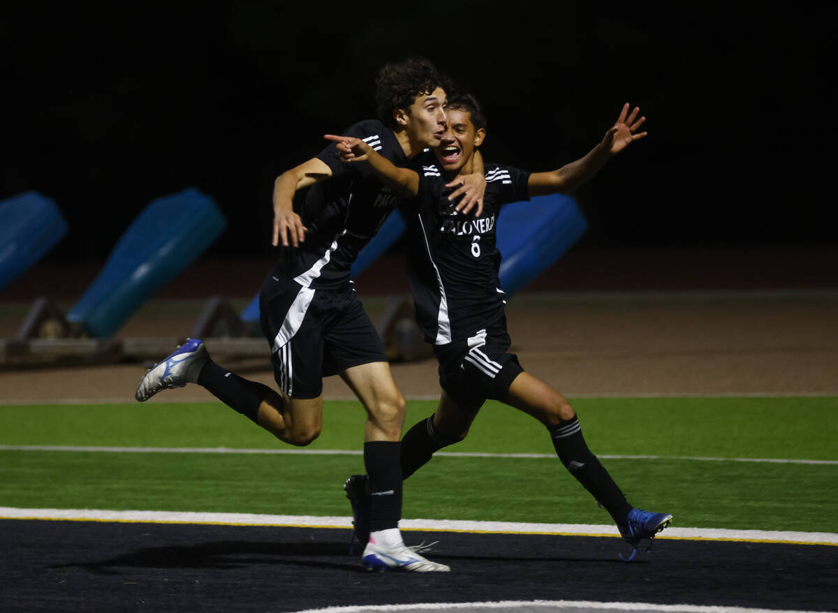 Palo Verde's Jonathan Villanueva (8) celebrates his goal with Palo Verde's defender Jose Ospina ...