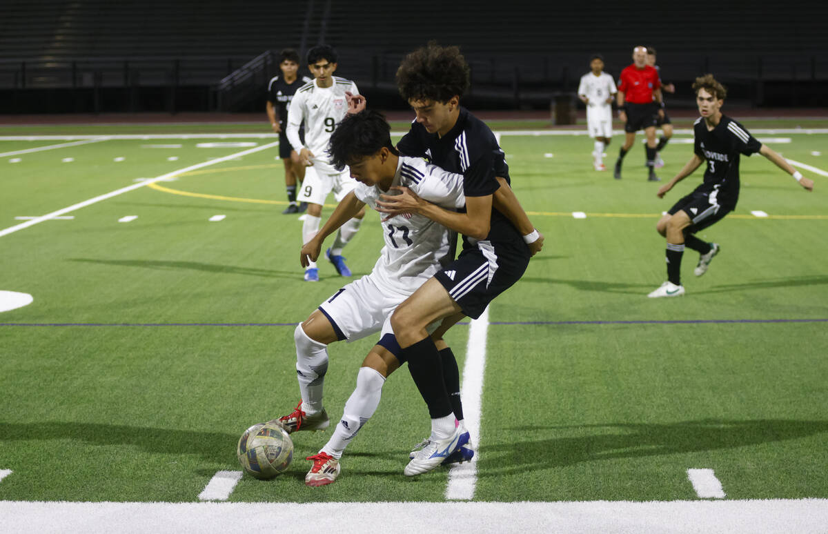 Las Vegas' Lex Madrigal (11) tries to keep the ball from Palo Verde’s Evan Odle dur ...