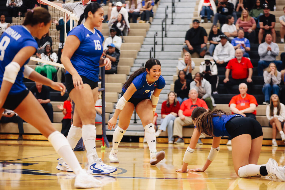 Bishop Gorman teammates Boyana Pesic (3) and Ayanna Watson (8) celebrate during a 5A girls voll ...
