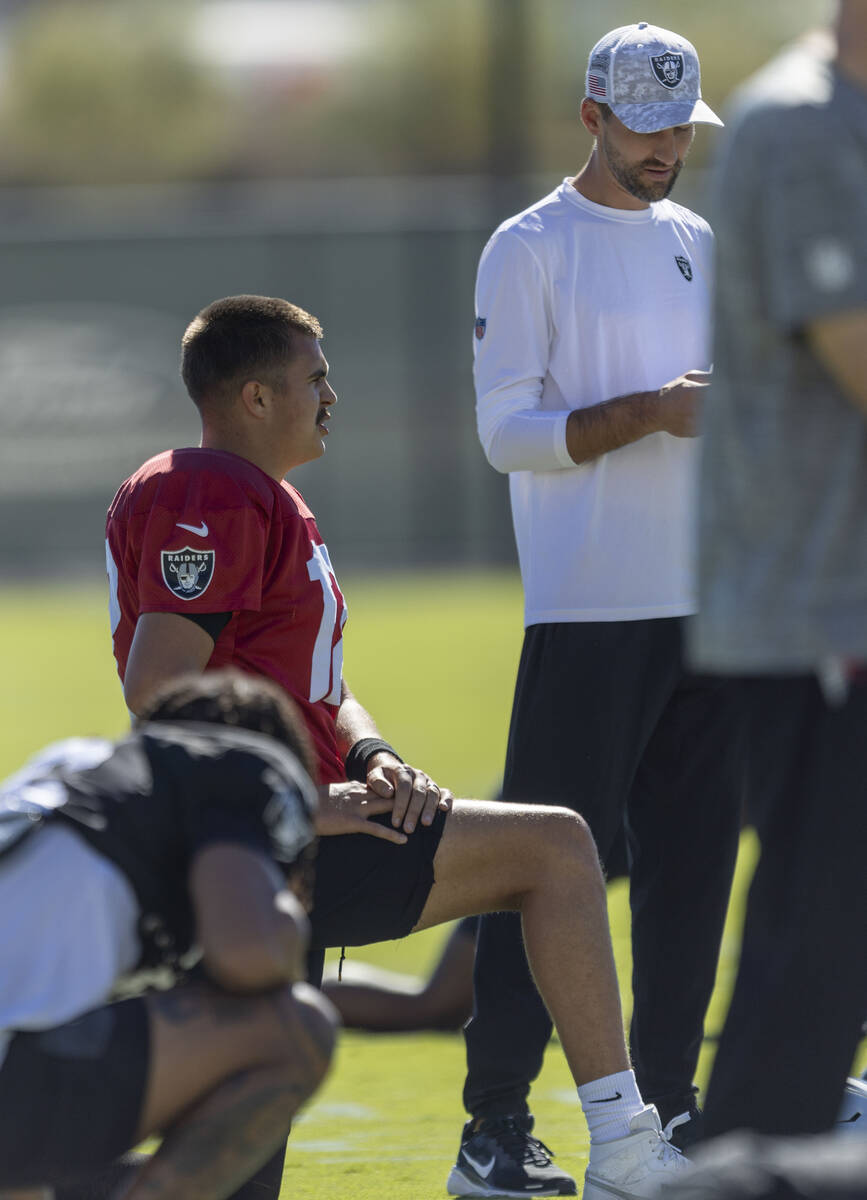 Raiders quarterback Aidan O'Connell (12) stretches during the team’s practice at th ...