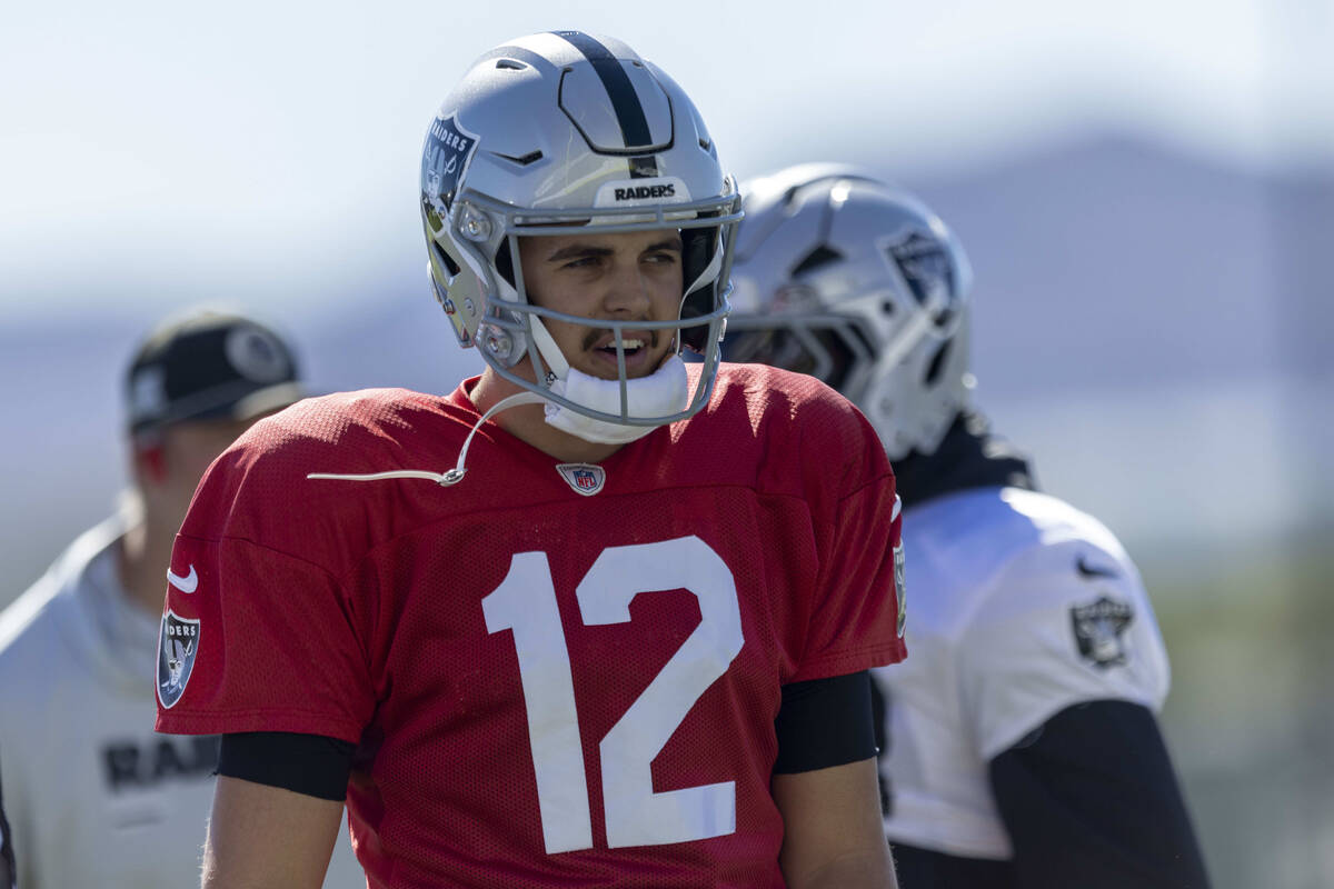 Raiders quarterback Aidan O'Connell (12) warms up during the team’s practice at the ...