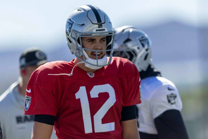 Raiders quarterback Aidan O'Connell (12) warms up during the team’s practice at the ...