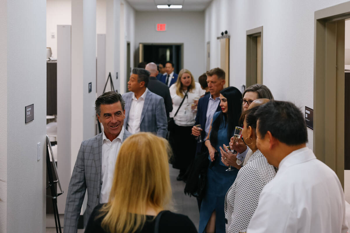 Guests to the ribbon-cutting tour the UNLV School of Dental Medicine’s new Advanced Needs Den ...