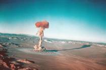 FILE - A sub-surface atomic test is shown March 23, 1955 at the Nevada Test Site near Yucca Fla ...