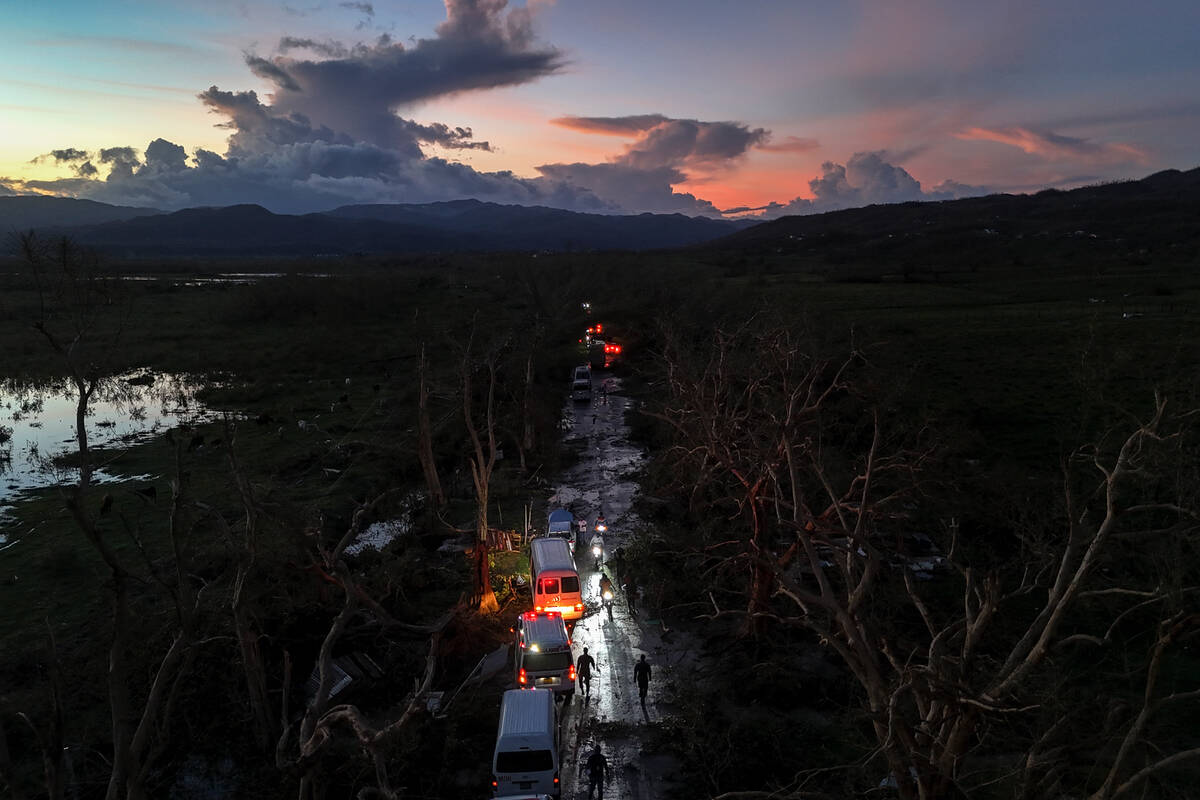 A convoy carrying aid to Black River, which was hit by Hurricane Melissa, makes its way through ...