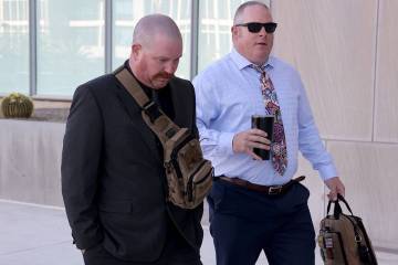 Metropolitan Police Department officers Vernon Ferguson, left, and Dan Emerton arrive at Lloyd ...