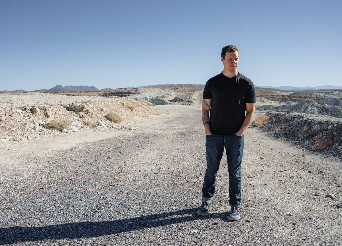 Mason Voehl, of the Amargosa Conservancy stands for a portrait at the top of a clinoptilolite m ...
